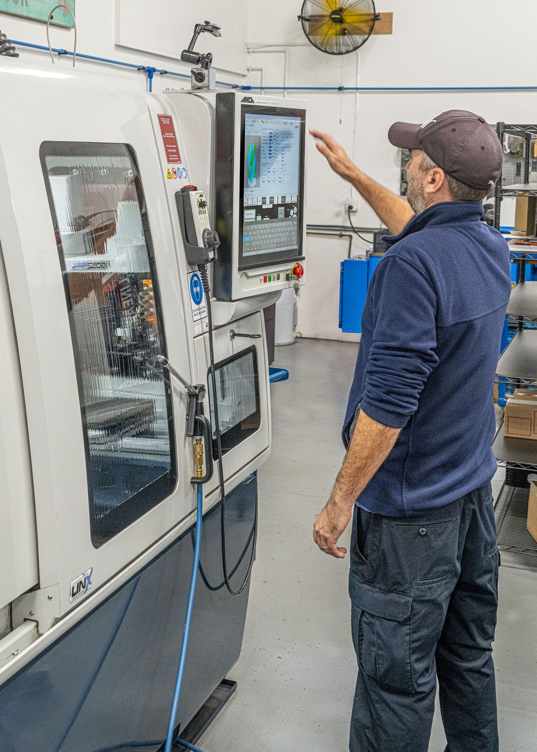 Man running CNC machine using Microcut tools